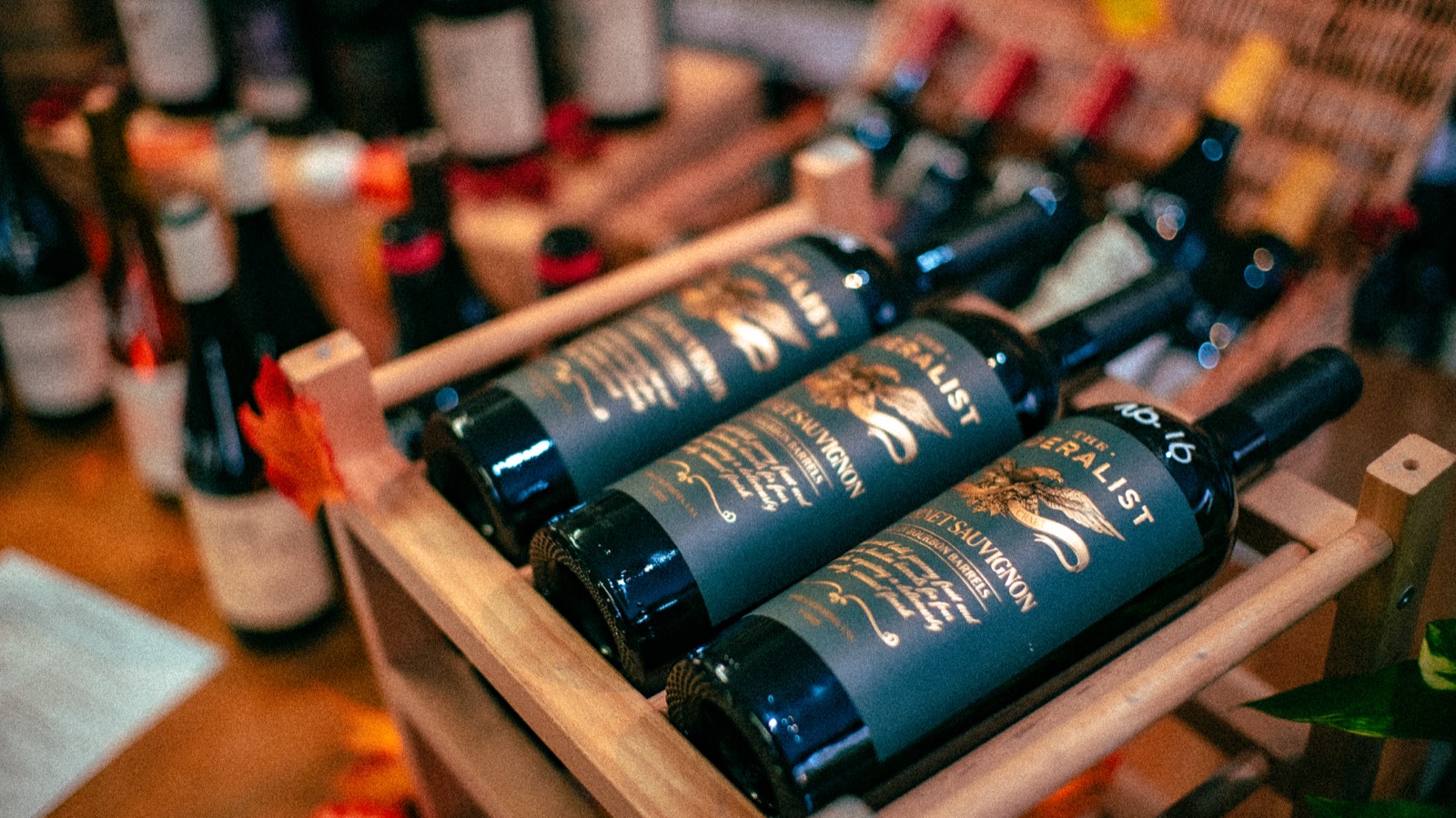 Boxed red wine bottles in a wooden crate